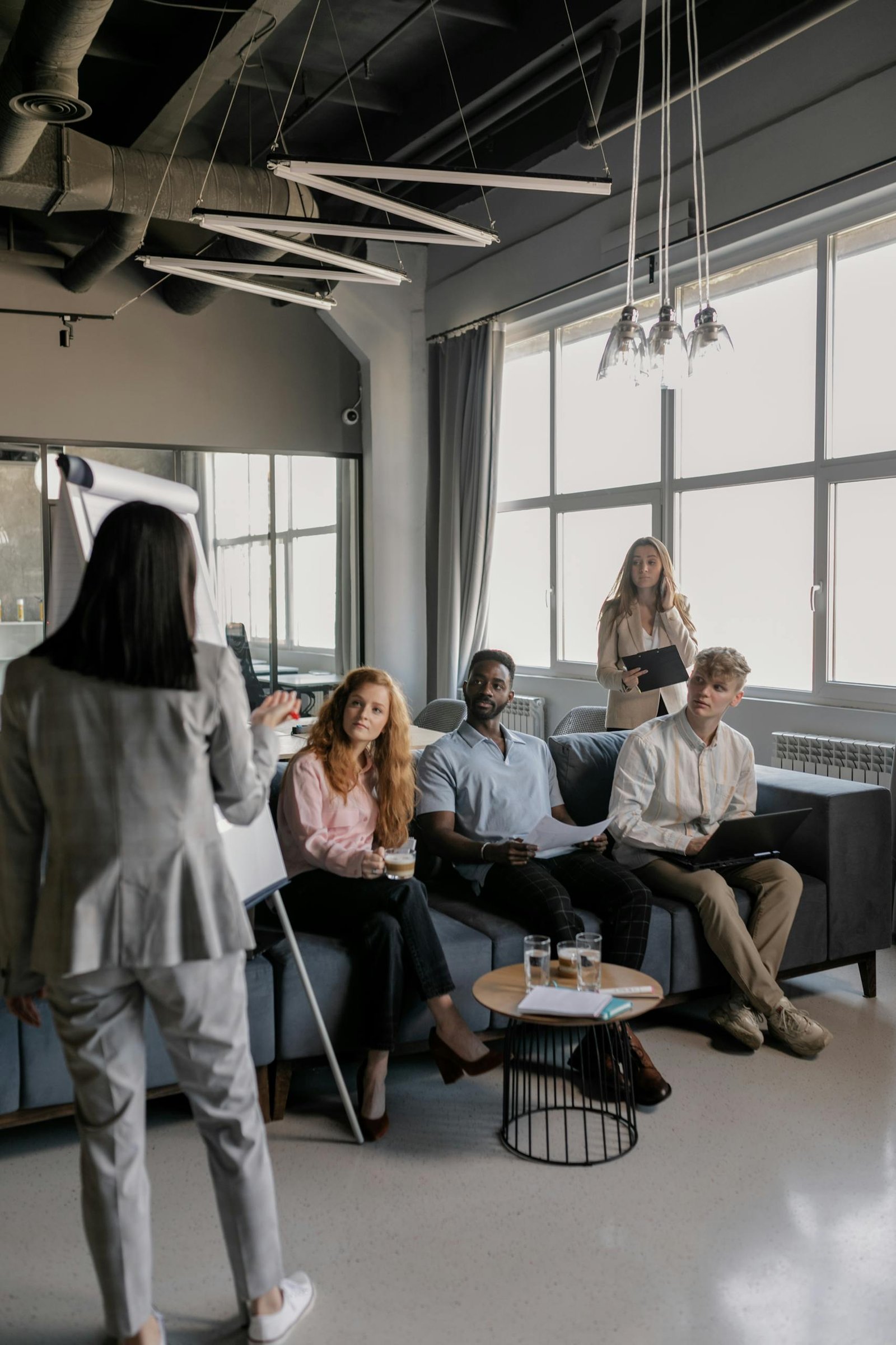 A team of professionals engaged in a Leadership Development meeting. Consulting Services